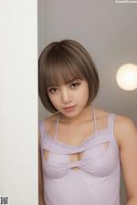 A woman in a purple tank top leaning against a wall.